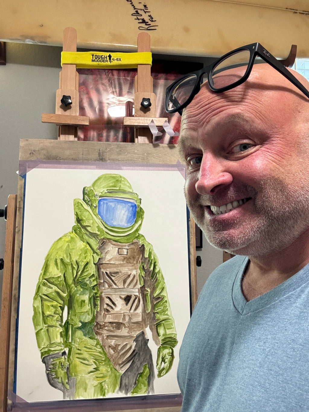 USMC veteran artist Timothy Colomer with custom bomb suit artwork