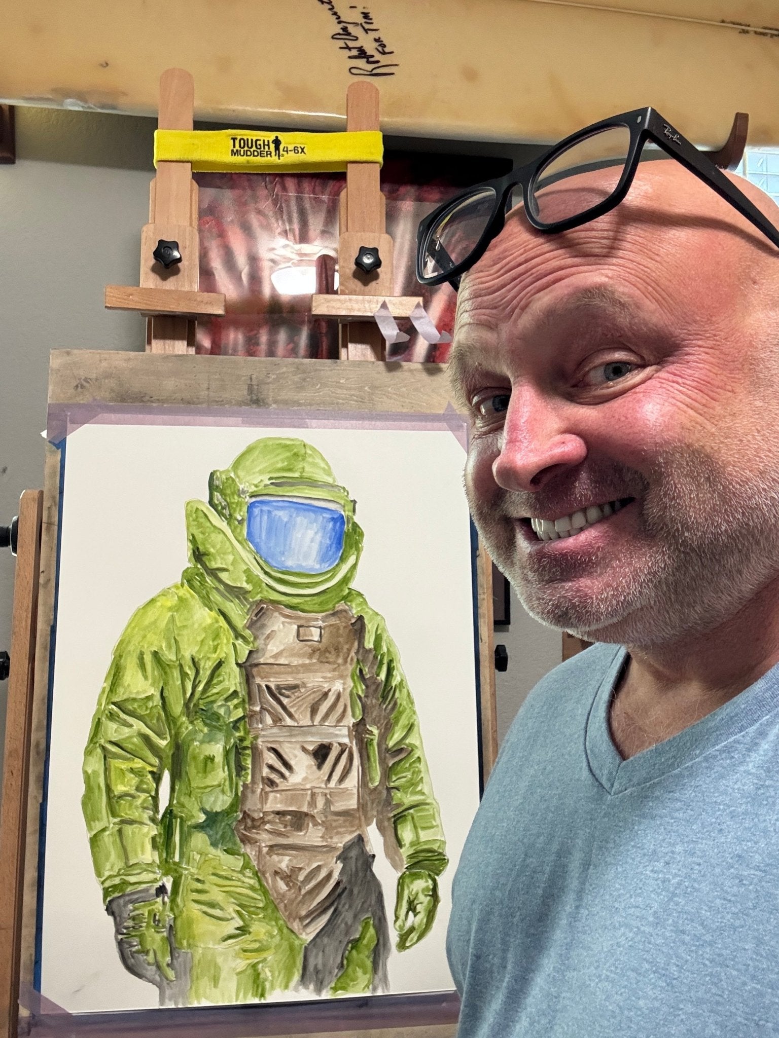 USMC veteran artist Timothy Colomer with custom bomb suit artwork